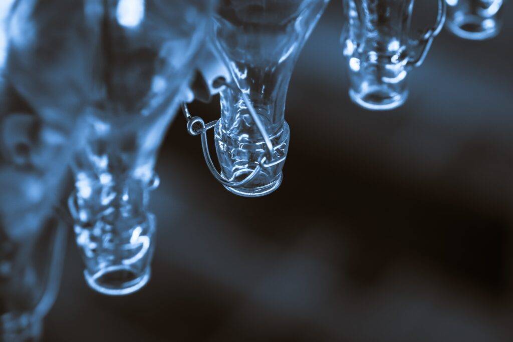 macro shot photography of clear glass bottles