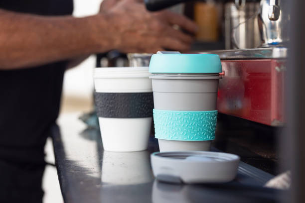 Barista At Mobile Coffee Van Using Reusable Coffee Cups