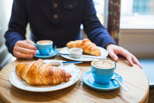 Coffee and croissant. French breakfast for two (Paris, France)
