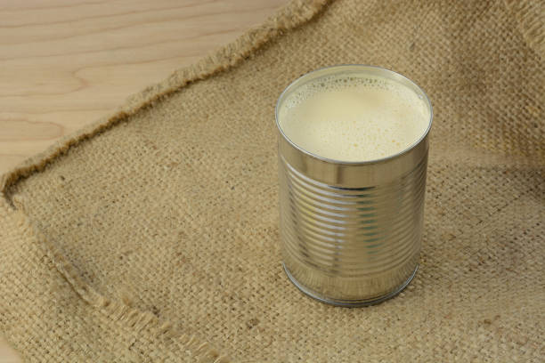 Condensed evaporated milk in can on burlap