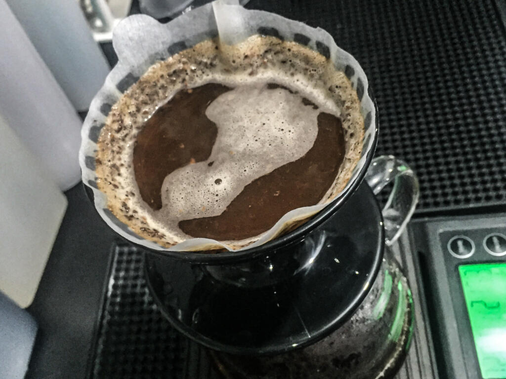 coffee grounds on filter paper brewed with hot water