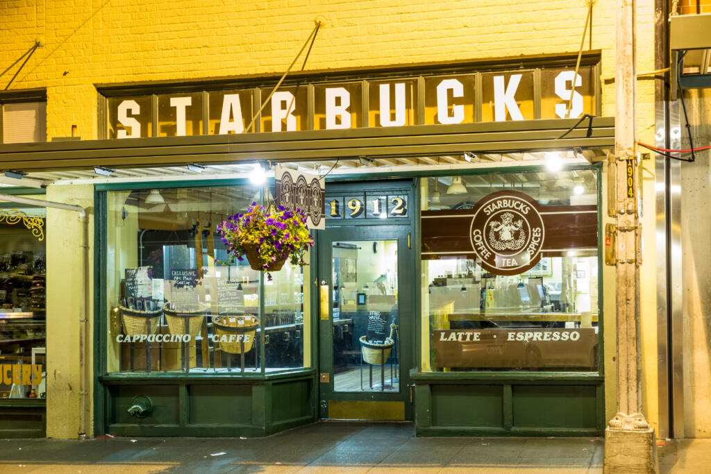 SEATTLE , USA - July 5, 2014: Original Starbucks store at 1912 Pike Place on July 5, 2014 in Seattle. Serving coffe in 20.891 stores in 62 countries, Starbucks is world's largest coffeehouse company.